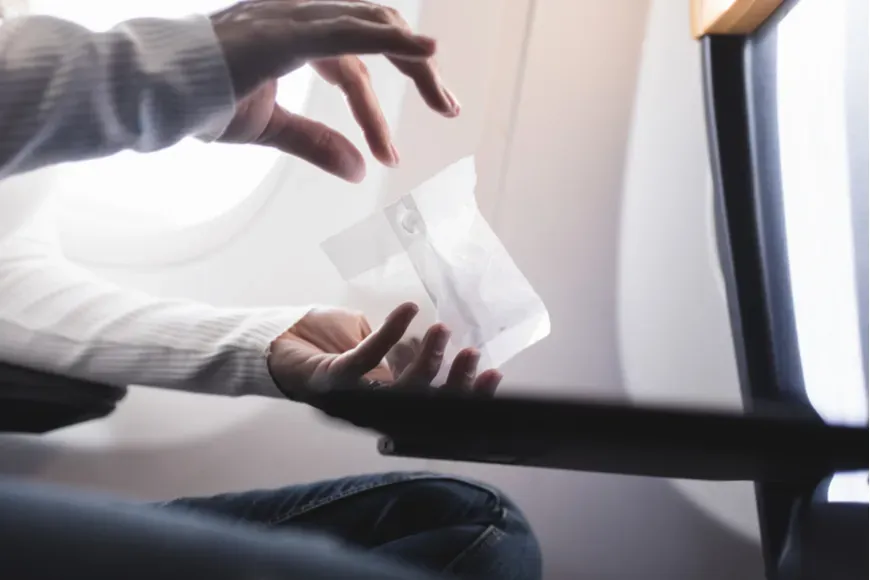 eating peanuts on plane.